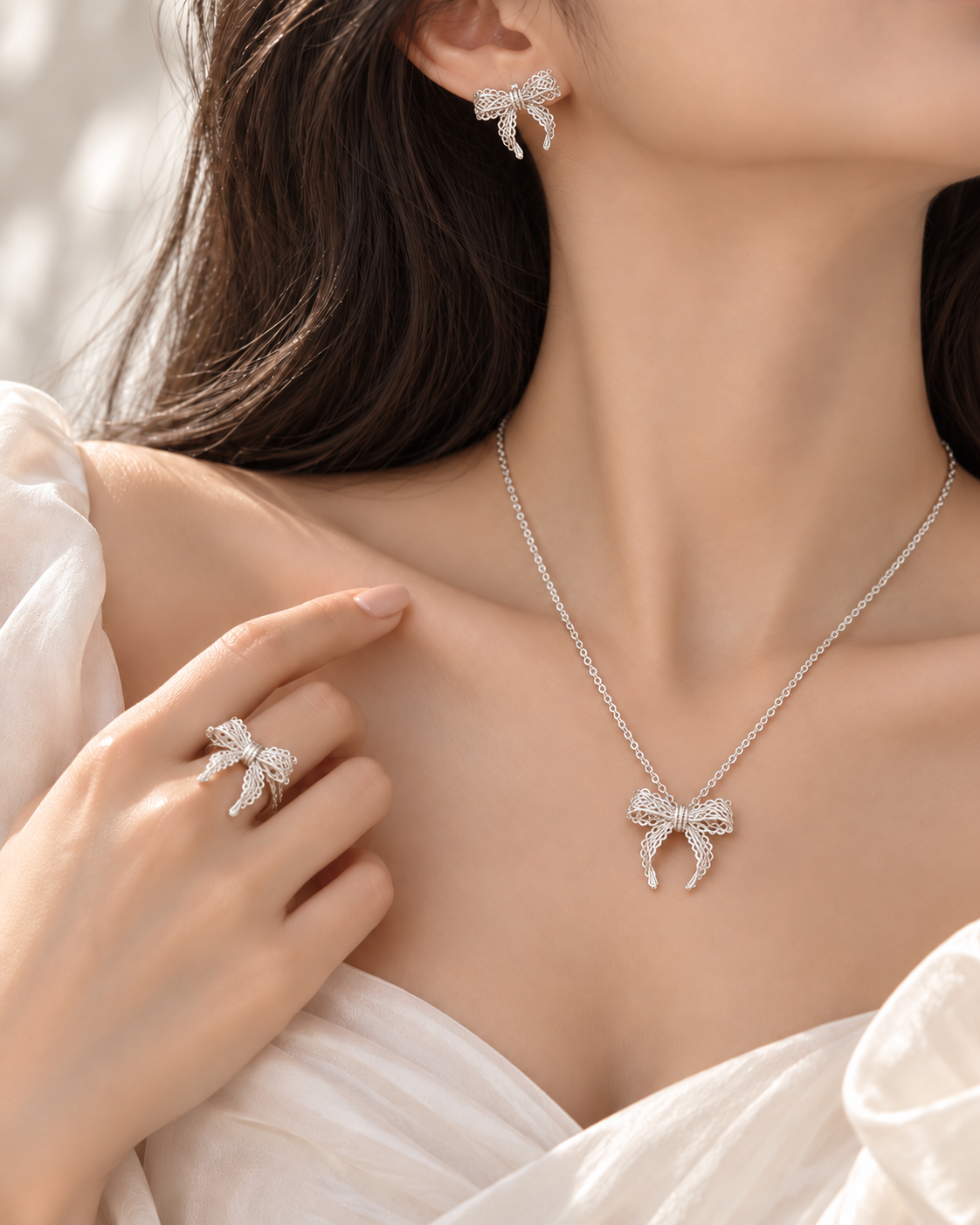 Lace Bow Set featuring an intricate sterling silver bow necklace, matching earrings and open ring by Avelune Collection.