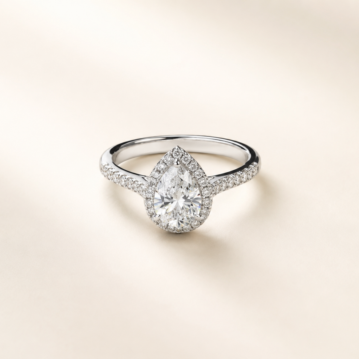 Lumière Pear halo ring with pear-cut moissanite in rhodium-plated sterling silver by Avelune Collection.