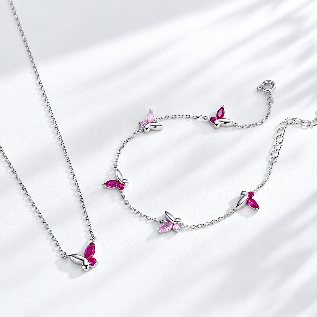 Blush Flutter sterling silver necklace and bracelet set with pink zircon butterfly-inspired details
