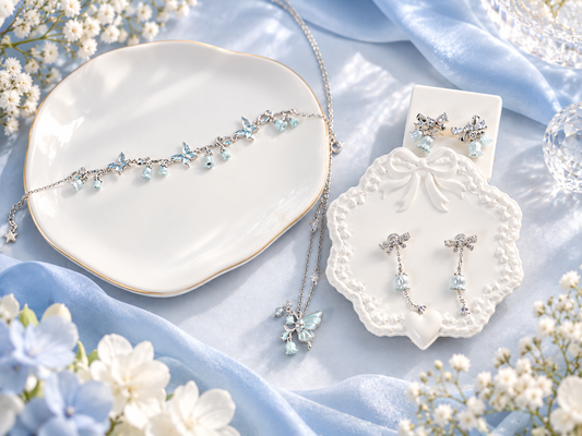 Frosted Bell Set featuring a 925 sterling silver floral necklace and matching bell-shaped earrings by Avelune Collection.